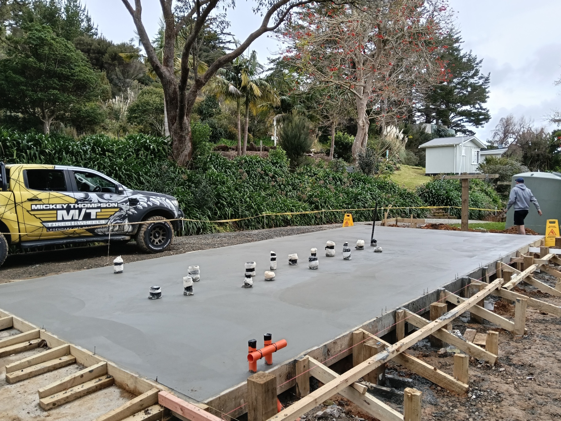 Large concrete house slab with timber formwork and plumbing penetrations by Henwood Concrete