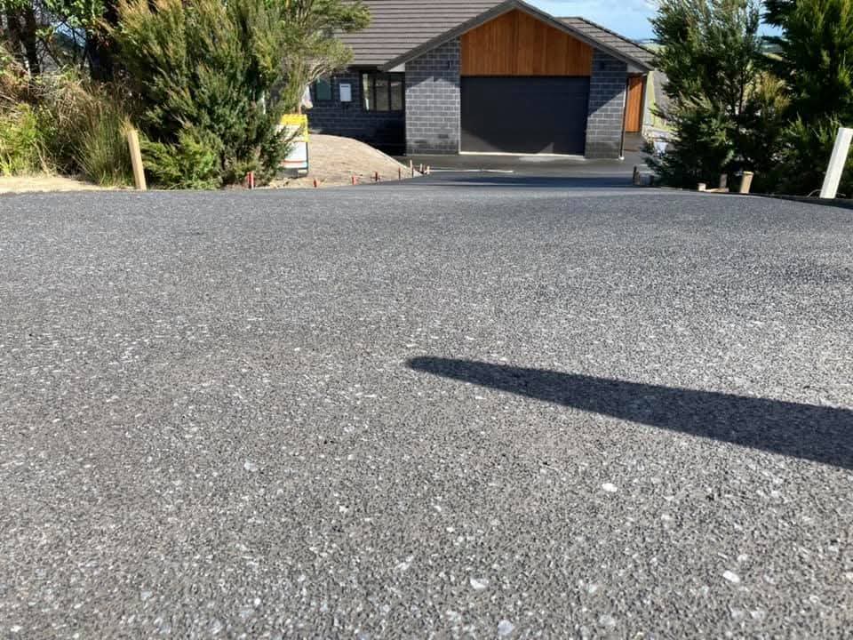 Completed exposed aggregate concrete driveway by Henwood Concrete.